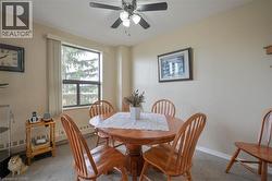 Dining area with a functional window and ceiling fan - 