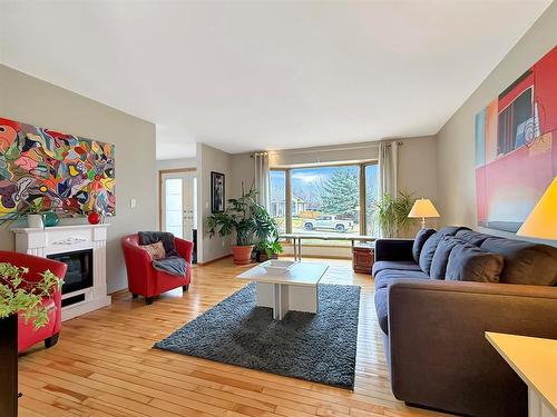 106 Braeview Place, Brandon, MB - Indoor Photo Showing Living Room With Fireplace