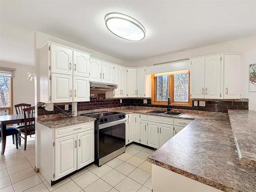 106 Braeview Place, Brandon, MB - Indoor Photo Showing Kitchen With Double Sink