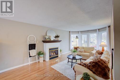 11 Bonniewood Drive, Mapleton, ON - Indoor Photo Showing Living Room With Fireplace