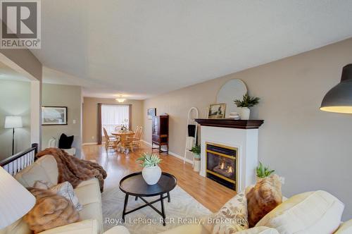 11 Bonniewood Drive, Mapleton, ON - Indoor Photo Showing Living Room With Fireplace