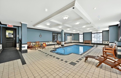 Pool - 102-45 Boul. Desjardins E., Sainte-Thérèse, QC - Indoor Photo Showing Other Room With In Ground Pool