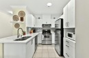 Kitchen - 102-45 Boul. Desjardins E., Sainte-Thérèse, QC  - Indoor Photo Showing Kitchen With Double Sink 