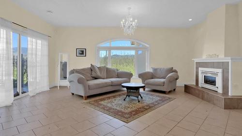 3240 Pooley Road, Kelowna, BC - Indoor Photo Showing Living Room With Fireplace