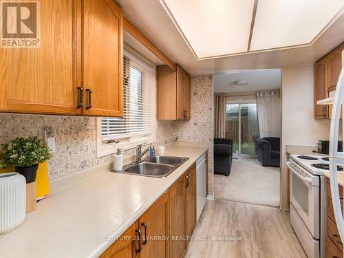 Galley style kitchen with lots of windows. - 1 Winnegreen Court, Ottawa, ON 