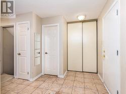 Foyer with powder room, note stairs to basement - 