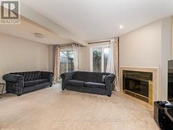 L shaped living/dining room with wood  fireplace - 