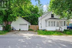 Front of house & detached garage. - 