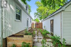 Lane between house and garage. - 
