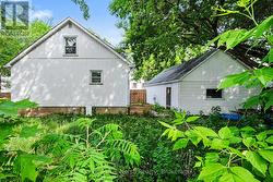 Rear view of house and garage - 