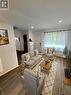 Living area featuring wood-finish flooring, recessed lighting, and a front entry door **Virtually Staged** - 148 Bishop Street S, Cambridge, ON 
