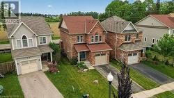 Brick and siding exterior featuring a prominent gable with arched window, an attached single-car garage, and a paved driveway - 