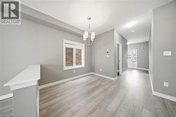 This property features light-toned flooring, light-colored walls, and a window providing natural light - 
