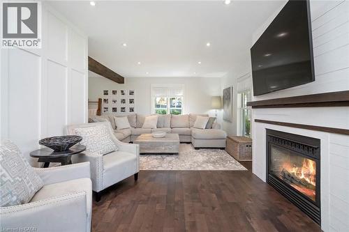 Family room with sitting area and gas fireplace - 58 Central Drive, Hamilton, ON 