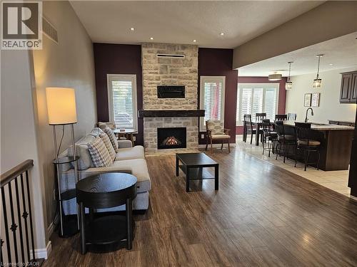 Open-concept layout - 98 Allandale Crescent, Simcoe, ON - Indoor Photo Showing Living Room With Fireplace