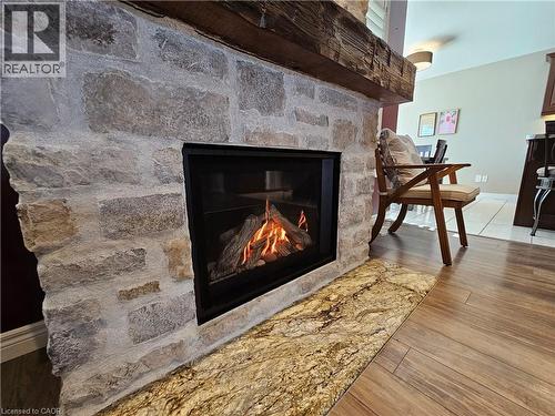 Stone Fireplace - 98 Allandale Crescent, Simcoe, ON - Indoor Photo Showing Living Room With Fireplace