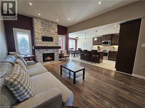 Custom Kitchen off Great Room - 98 Allandale Crescent, Simcoe, ON - Indoor Photo Showing Living Room With Fireplace