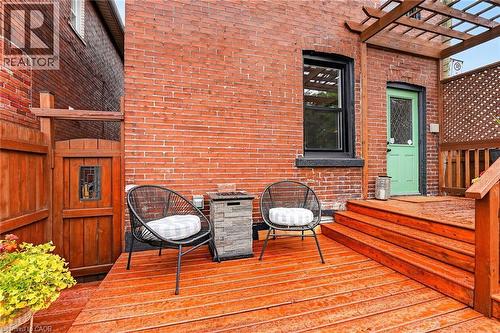 Redwood deck with three steps and a pergola accent - 26 Campbell Avenue, Hamilton, ON 