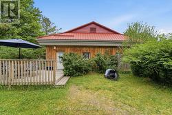 Back deck on east side, showing access to Unit 3. - 