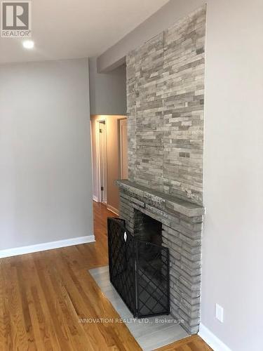 Double sided fireplace between living & eat-in kit - 2329 Ryder Street, Ottawa, ON 