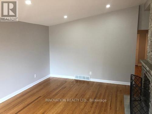Main floor living room with dual sided fireplace - 2329 Ryder Street, Ottawa, ON 