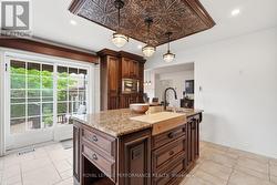 Walkout to the backyard with patio doors - 