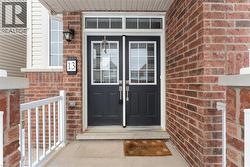 Doorway to property with brick siding - 