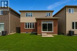 Rear exterior featuring a brick and siding facade - 