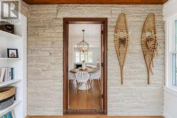 Exposed stone walls & red oak ceilings above - 