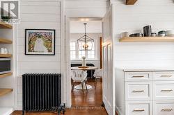 A swinging door leads to the designer kitchen - 
