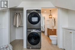 Oversized walk-in closet with stackable laundry - 