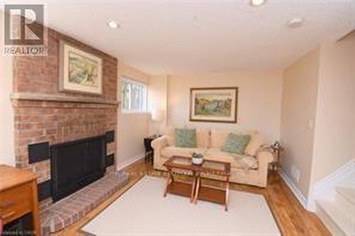 Above ground family room w woodburning fireplace - 3200 Greenbough Crescent, Burlington, ON 