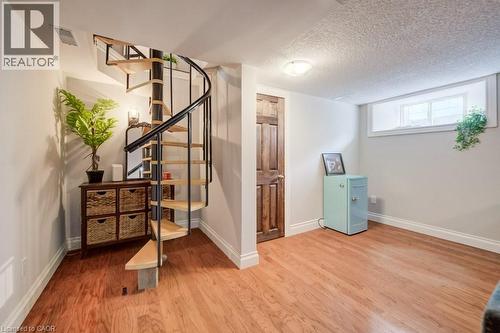 Beautiful Stairs to Lower Level - 35 Schweitzer Street, Kitchener, ON - Indoor Photo Showing Other Room