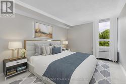 Primary bed, newly installed rug, virtually staged - 