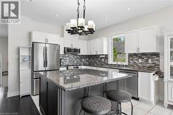 Oversized island perfect for prep and gathering. - 