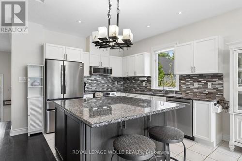 Oversized island perfect for prep and gathering. - 43 Allegra Drive, Wasaga Beach, ON 