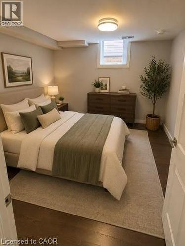 Bedroom featuring a flush-mount ceiling light, a window with blinds, and rich wood-finish flooring - 39 Forestgate Drive, Hamilton, ON 