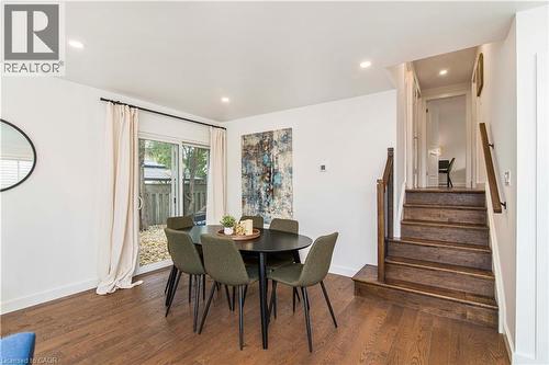 Wood-finish flooring throughout, featuring a staircase with wood treads and handrails - 39 Forestgate Drive, Hamilton, ON 