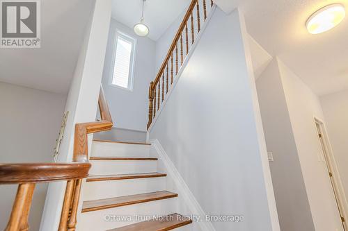 Hardwood staircase with large window - 110 Macara Crescent, Ottawa, ON 