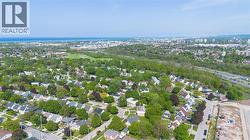 Aerial perspective showcasing a residential neighborhood with mature trees - 