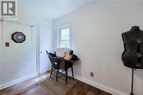 Room with wood-finish flooring, white baseboards, and a white painted wall - 73 West 1St Street, Hamilton, ON 