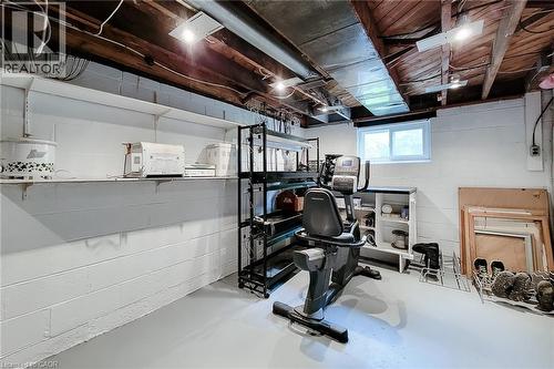 Painted concrete block walls featuring extensive shelving and a wood-paneled ceiling - 73 West 1St Street, Hamilton, ON 