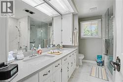 Dual vanity with integrated sinks and a light-toned countertop - 