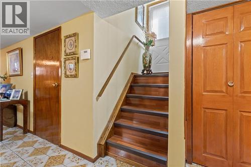 Hardwood staircase with integrated treads. - 202 Ray Street N, Hamilton, ON - Indoor Photo Showing Other Room