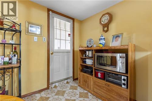White paneled door with integrated blinds. - 202 Ray Street N, Hamilton, ON - Indoor Photo Showing Other Room