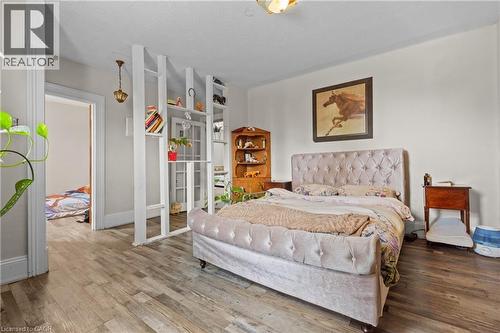 Bedroom featuring wood-finish flooring and light-toned walls. - 193 Locke Street N, Hamilton, ON - Indoor Photo Showing Bedroom