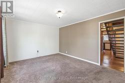 Front living room facing into the hallway - 