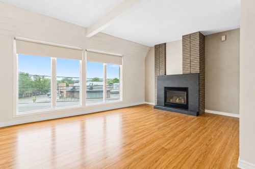 Dwelling - 2049  - 2051 Boul. Du Curé-Labelle, Saint-Jérôme, QC - Indoor Photo Showing Living Room With Fireplace