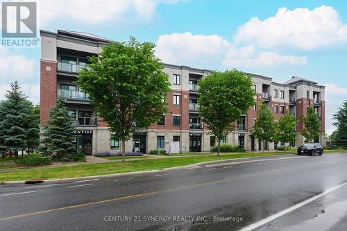 201 - 615 Longfields Drive, Ottawa, ON - Outdoor With Balcony With Facade