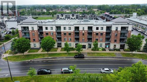 201 - 615 Longfields Drive, Ottawa, ON - Outdoor With Balcony With Facade